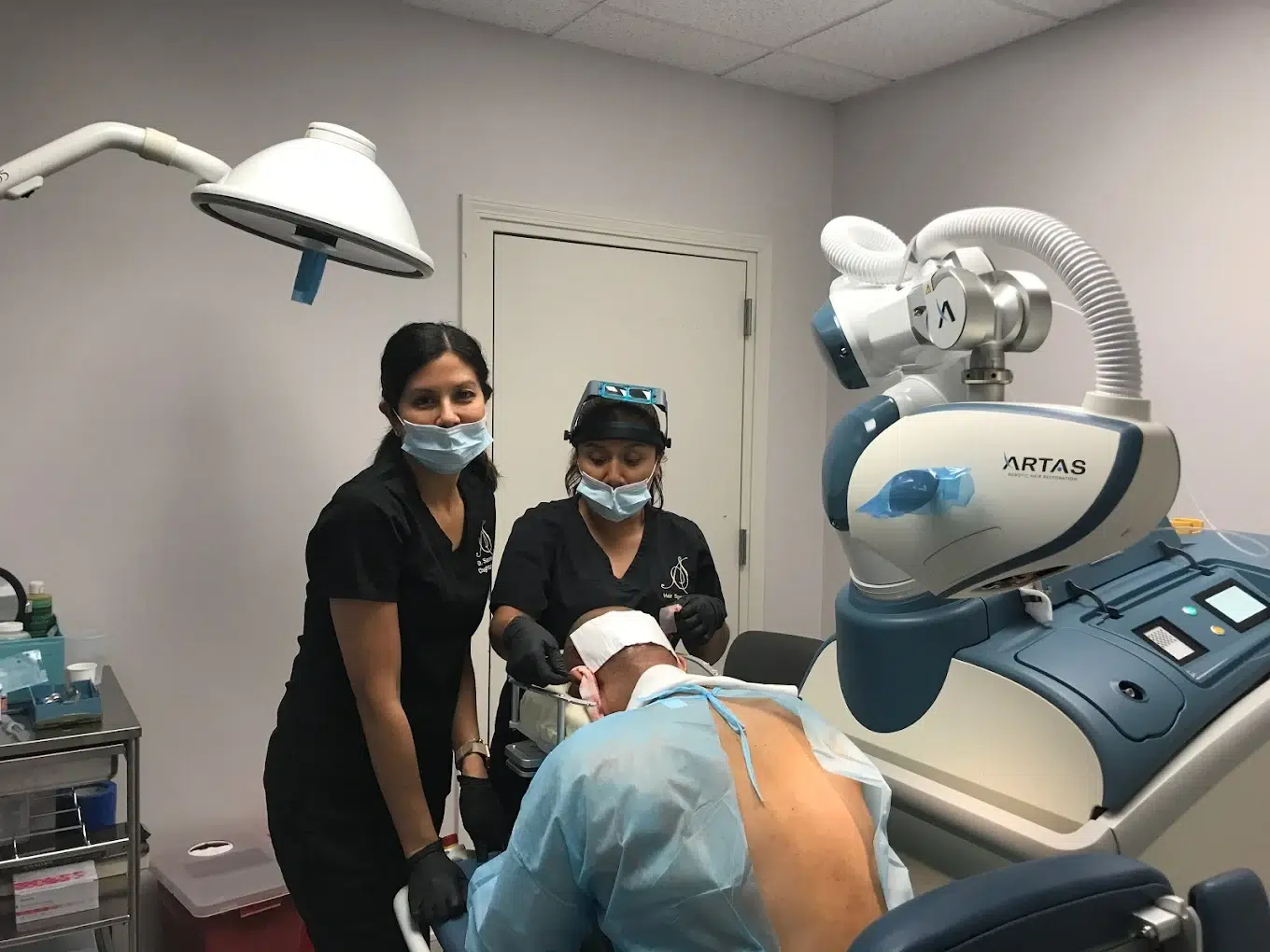 patient getting artas hair treatment