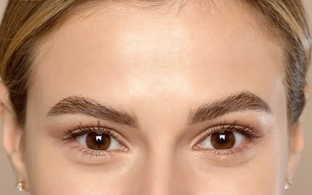 close up of the eyes and forehead of a lovely young woman