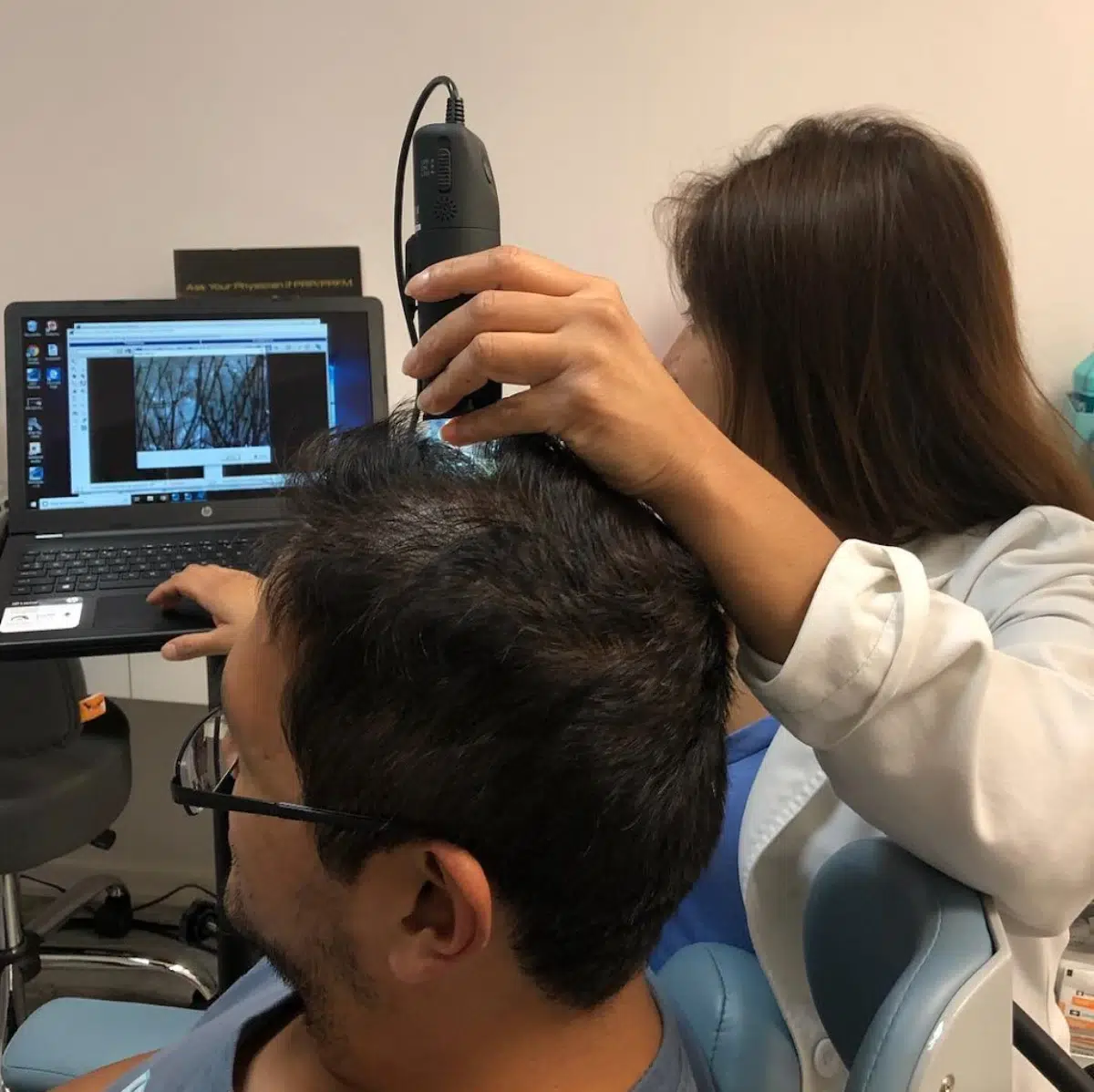 dr Shah Chughtai working on patients scalp