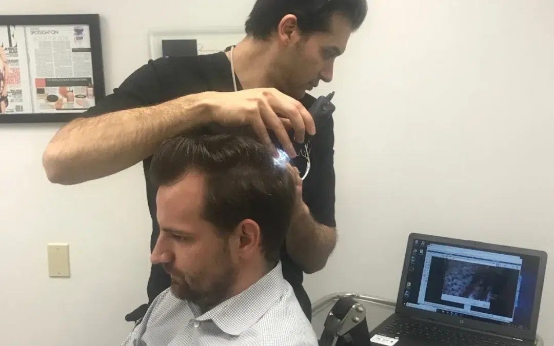 dr anil shah working on patients scalp