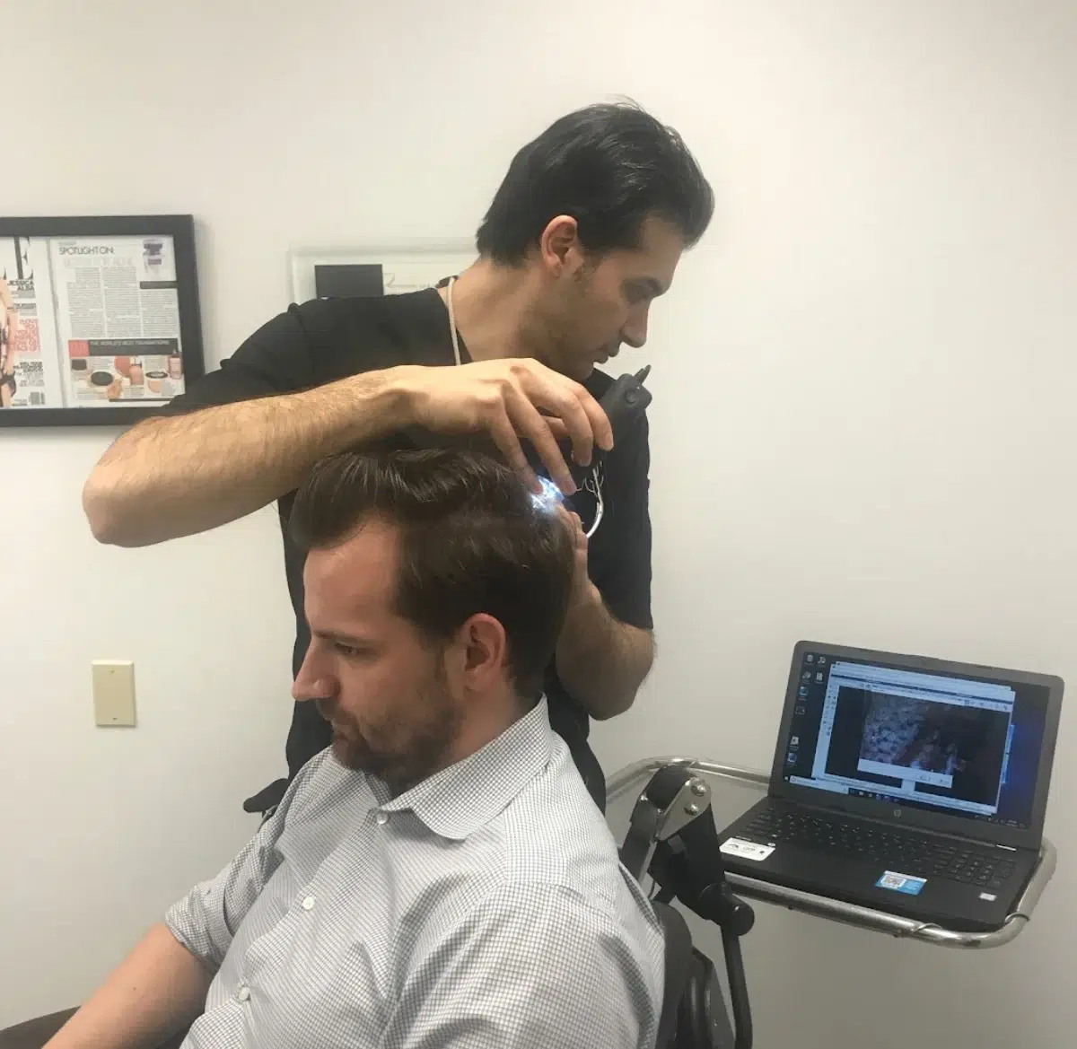 dr anil shah working on patients scalp